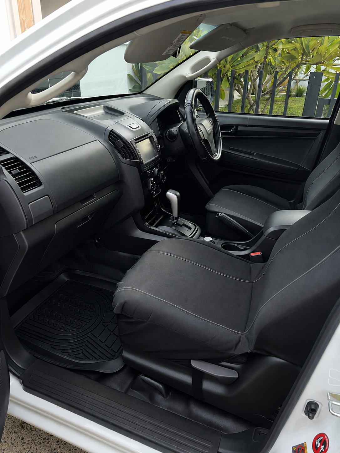 Same ute cabin after detailing with clean seats, mats and dashboard